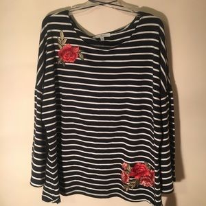 Navy & white striped trumpet sleeve top.